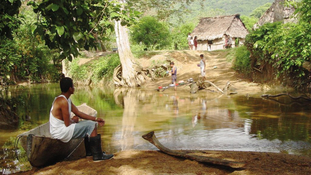 Homes by a river in rural Honduras.